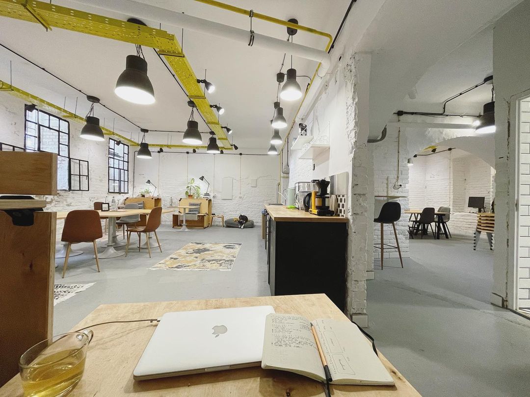 white brick walls, lots of wood, warm yellow details, a Dog called Alka sleeping in her beanbag bed